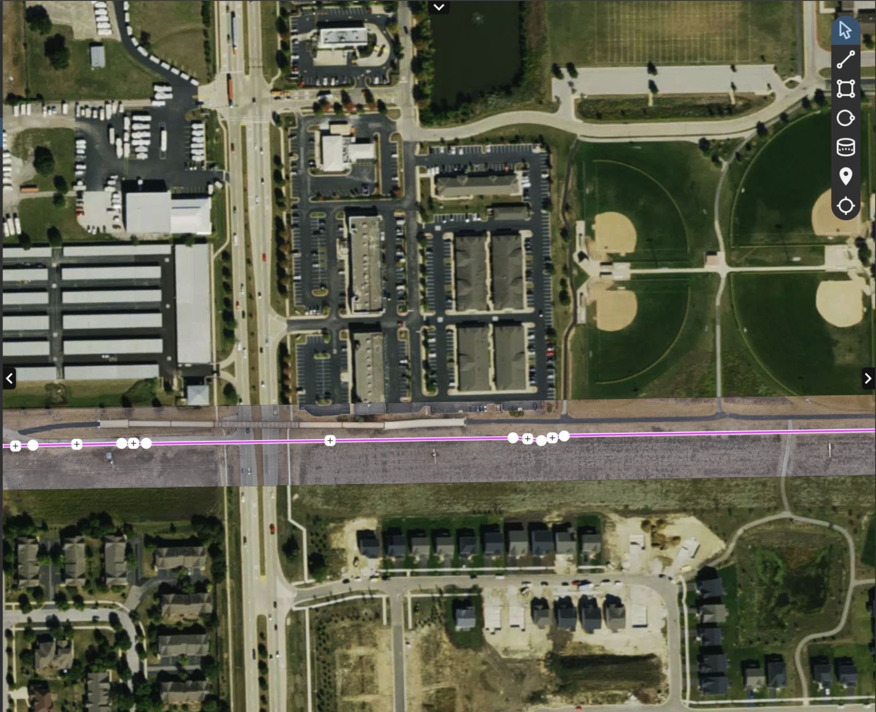 Aerial orthomosaic strip of the corridor overlaid on satellite imagery with alignment vector